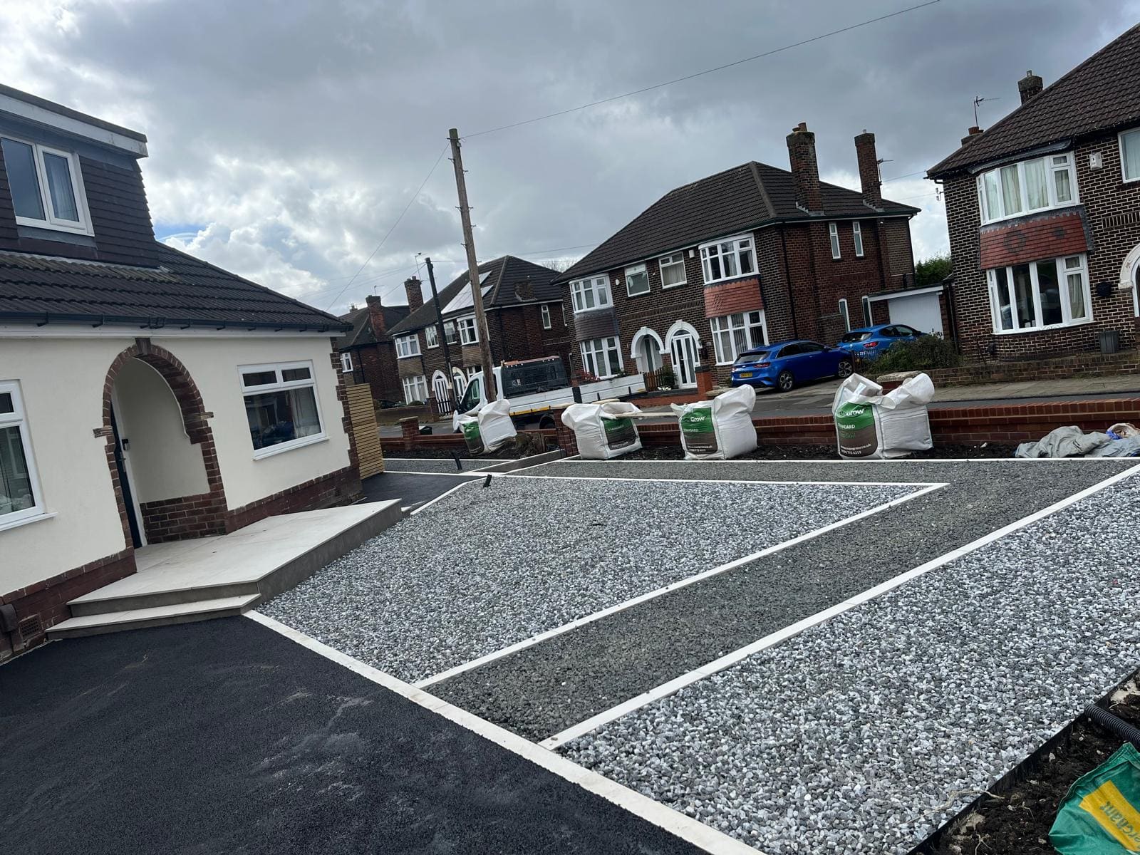 Gravel driveway line marked bays